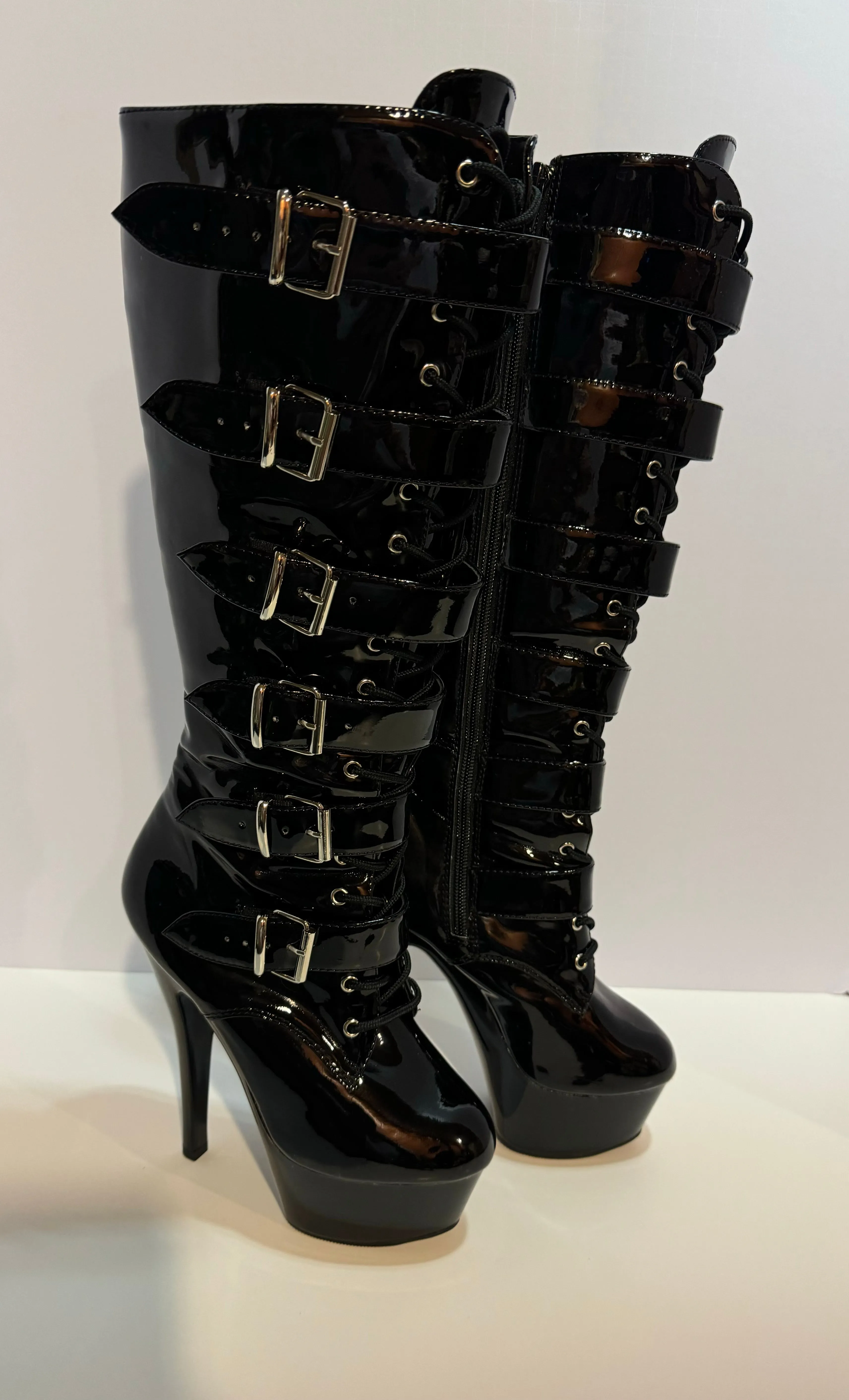 Gorgeous lace up, zipper, buckle, wedge high heel boots .